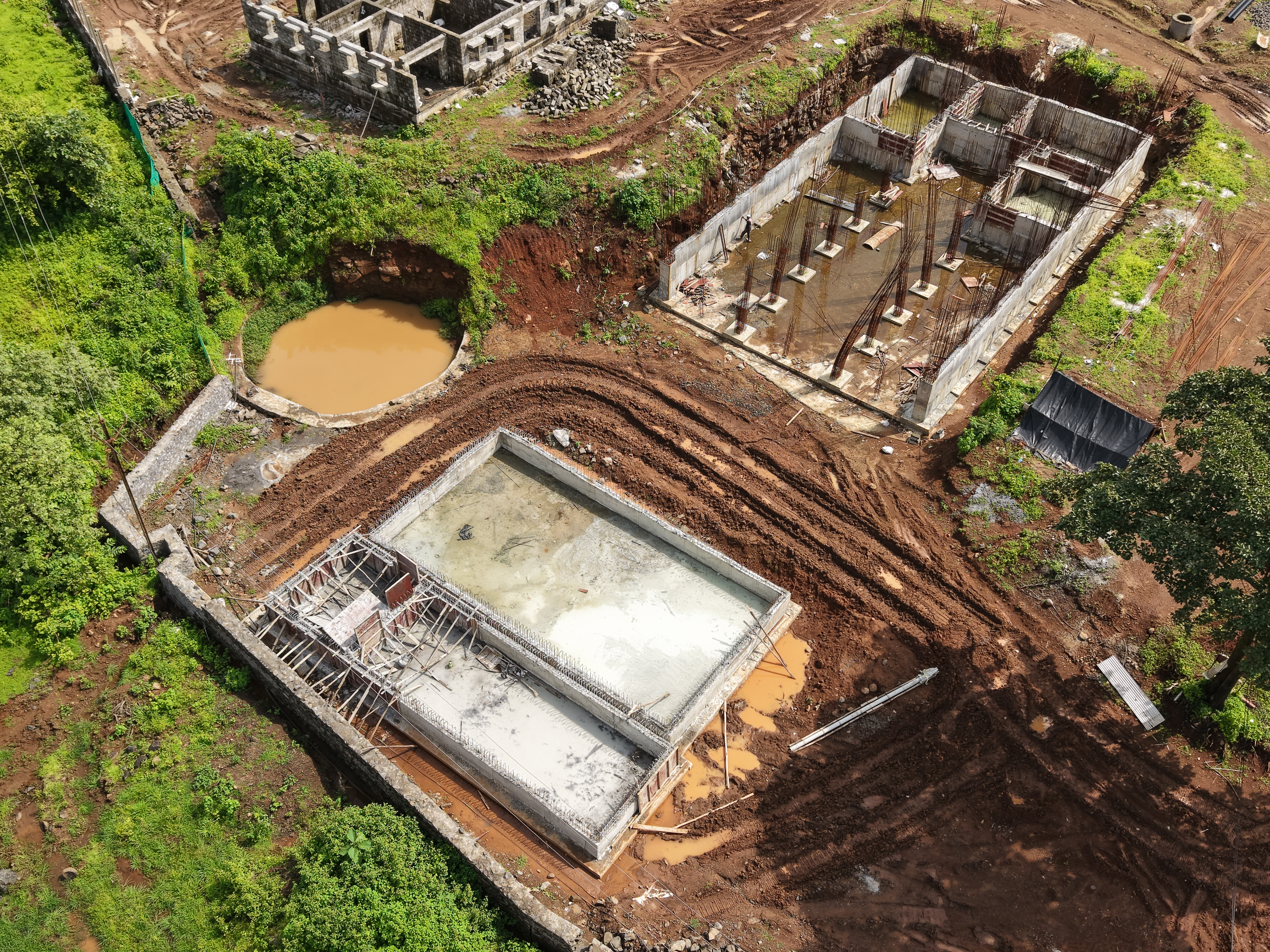 Aerial view of the swimming pool walls and dining hall under construction at the Hi 5 Basketball Academy