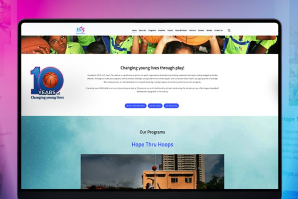 The new Hi 5 Youth Foundation homepage shown on a laptop