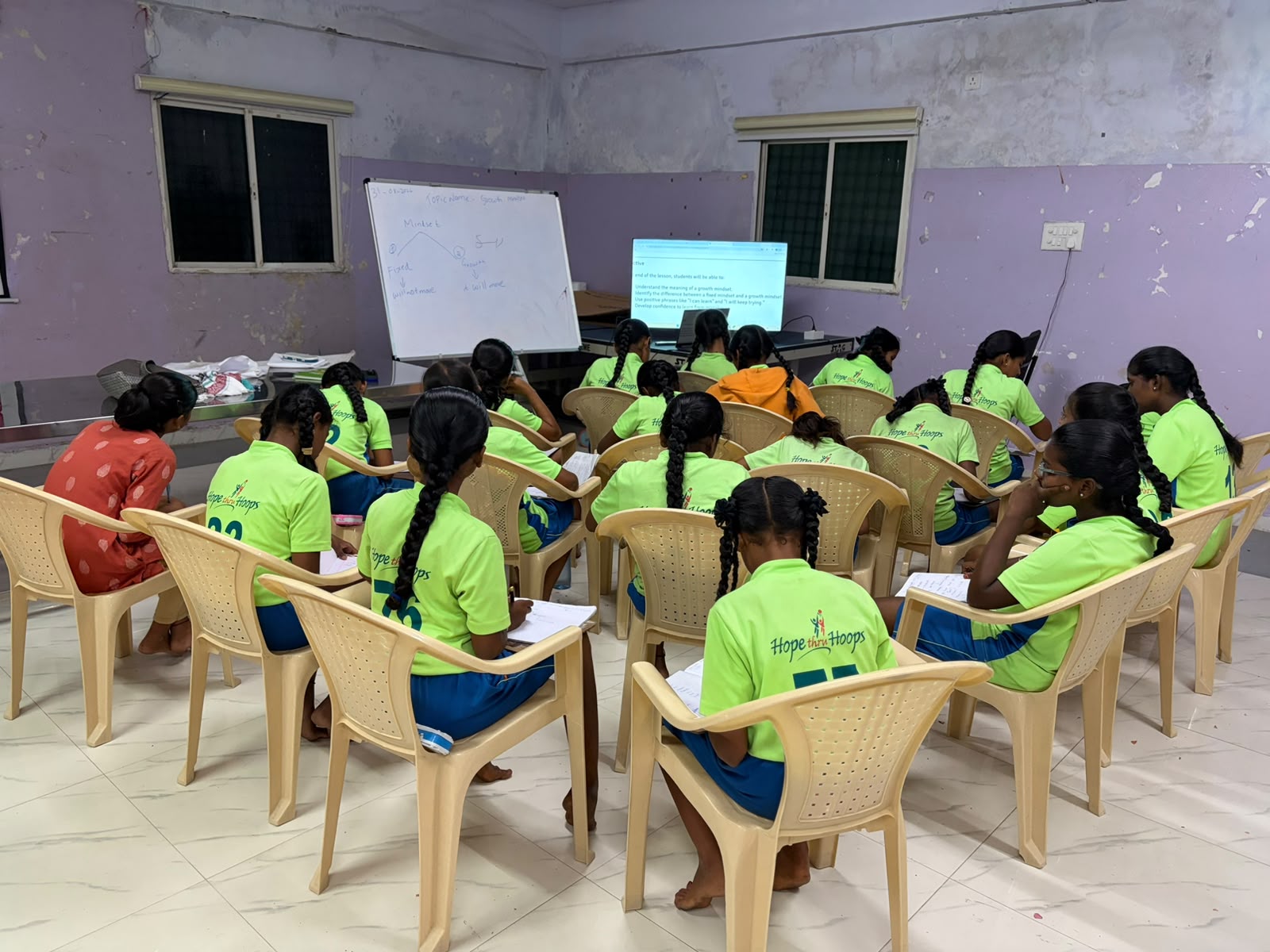 Girls attending an online English class in the Pathways to Success programme